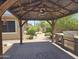 An outdoor gazebo with stainless steel bbq, counter and ceiling fan, perfect for relaxing and entertaining at 549 E Benrich Dr, Gilbert, AZ 85295