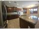Kitchen featuring granite countertops, stainless steel appliances, and breakfast bar seating at 549 E Benrich Dr, Gilbert, AZ 85295