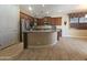 Well-appointed kitchen with stainless steel appliances, island and granite countertops at 549 E Benrich Dr, Gilbert, AZ 85295