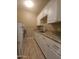 Laundry room with washer, dryer, granite counters, and white cabinets at 549 E Benrich Dr, Gilbert, AZ 85295