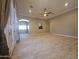 Expansive living room with tile flooring, neutral walls, recessed lighting, and an open layout for versatile living at 549 E Benrich Dr, Gilbert, AZ 85295