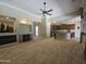 Living room with fireplace and archway to kitchen featuring stainless steel appliances at 549 E Benrich Dr, Gilbert, AZ 85295