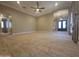 Open-concept living room featuring tile floors, neutral paint, and archways to other rooms at 549 E Benrich Dr, Gilbert, AZ 85295