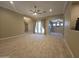 Spacious living room with travertine floors, recessed lighting and access to backyard at 549 E Benrich Dr, Gilbert, AZ 85295