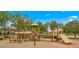 Community playground with multiple structures, slides, and play areas for enjoyment at 549 E Benrich Dr, Gilbert, AZ 85295