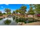 Vintage Ranch community entrance featuring a serene water feature, rock accents, and lush landscaping at 549 E Benrich Dr, Gilbert, AZ 85295