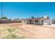 The back of the house features a covered back patio and large backyard at 6223 W Earll Dr, Phoenix, AZ 85033