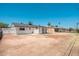 Back exterior features a covered patio and a large backyard with potential at 6223 W Earll Dr, Phoenix, AZ 85033