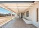 Covered back patio features concrete flooring and views of the large backyard at 6223 W Earll Dr, Phoenix, AZ 85033