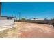 Large backyard with gravel, block wall, and detached structure at 6223 W Earll Dr, Phoenix, AZ 85033