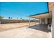 The covered back patio overlooks a large, sunny backyard at 6223 W Earll Dr, Phoenix, AZ 85033