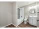 Bathroom features modern design, white fixtures and vanity, and patterned tile at 6223 W Earll Dr, Phoenix, AZ 85033