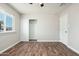 Well-lit bedroom showcasing closet space, natural light, and modern flooring at 6223 W Earll Dr, Phoenix, AZ 85033