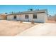 Charming single-story home featuring a fresh white painted exterior and a simple desert landscape at 6223 W Earll Dr, Phoenix, AZ 85033
