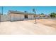 Exterior view featuring a single-story home with a front yard and a paved driveway leading to a garage at 6223 W Earll Dr, Phoenix, AZ 85033