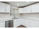Modern kitchen features stainless steel appliances, bright white cabinets, and a stylish stainless dishwasher at 6223 W Earll Dr, Phoenix, AZ 85033