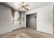 Bedroom with ceiling fan, natural light, and closet at 6335 W Osborn Rd, Phoenix, AZ 85033