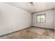 Simple bedroom with a window offers natural light, awaiting your personal touch at 6335 W Osborn Rd, Phoenix, AZ 85033