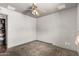 Empty bedroom with ceiling fan and adjoining room at 6335 W Osborn Rd, Phoenix, AZ 85033