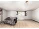 Spacious living room featuring tile flooring, window, and an exterior door at 6335 W Osborn Rd, Phoenix, AZ 85033