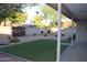 Cozy backyard featuring a small patch of grass and a covered patio, perfect for outdoor entertaining at 6702 E Almeria Rd, Scottsdale, AZ 85257