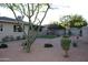 Well-maintained backyard with desert landscaping and artificial grass, creating a low-maintenance outdoor space at 6702 E Almeria Rd, Scottsdale, AZ 85257