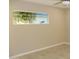 Bedroom featuring tiled floor, ceiling fan and window with natural light at 6702 E Almeria Rd, Scottsdale, AZ 85257