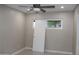Bedroom featuring neutral walls, tile flooring, and a closet with a sliding door at 6702 E Almeria Rd, Scottsdale, AZ 85257