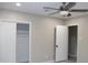 Bedroom with a ceiling fan, closet with sliding doors, and neutral paint at 6702 E Almeria Rd, Scottsdale, AZ 85257