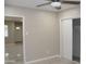 Cozy bedroom with tile flooring, ceiling fan, and sliding closet doors at 6702 E Almeria Rd, Scottsdale, AZ 85257