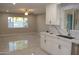 Open kitchen with marble countertops and stainless-steel sink, seamlessly connected to the living area at 6702 E Almeria Rd, Scottsdale, AZ 85257