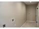 This laundry room is equipped with utility hookups, flooring, and neutral colors at 6702 E Almeria Rd, Scottsdale, AZ 85257
