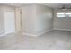 Spacious living room featuring tile flooring and ample natural light, creating a welcoming atmosphere at 6702 E Almeria Rd, Scottsdale, AZ 85257