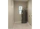 The utility room features a water heater, window, and tiled floor at 6702 E Almeria Rd, Scottsdale, AZ 85257