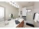 Bright bathroom featuring a double sink vanity with modern fixtures and a shower-tub combination at 6937 W Jackrabbit Ln, Peoria, AZ 85383