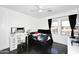 Bright bedroom with a vanity, desk, and two windows offering natural light at 6937 W Jackrabbit Ln, Peoria, AZ 85383