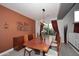 Stylish dining room featuring modern light fixture and seating for six at 6937 W Jackrabbit Ln, Peoria, AZ 85383