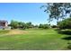 Expansive community green space, perfect for outdoor activities and relaxation, with neighborhood homes in the background at 6937 W Jackrabbit Ln, Peoria, AZ 85383
