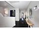 Inviting hallway with dark wood floors and elegant decor at 6937 W Jackrabbit Ln, Peoria, AZ 85383