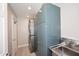 Functional laundry room with a stacked washer/dryer and utility sink at 6937 W Jackrabbit Ln, Peoria, AZ 85383