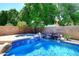 Resort-style pool featuring a spa with beautiful blue tile at 6937 W Jackrabbit Ln, Peoria, AZ 85383