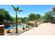 Beautiful pool area with mature trees and lush landscaping at 6937 W Jackrabbit Ln, Peoria, AZ 85383