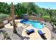 Stunning pool and spa area with comfortable lounge chairs at 6937 W Jackrabbit Ln, Peoria, AZ 85383