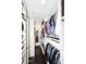 Organized walk-in closet with custom shelving and ample storage space for clothes and accessories at 6937 W Jackrabbit Ln, Peoria, AZ 85383
