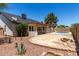 Exterior of home with desert landscaping, a covered patio, and a fenced-in pool at 723 E Piute Ave, Phoenix, AZ 85024