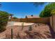 Desert landscaped backyard features small plants and a gravel ground cover at 723 E Piute Ave, Phoenix, AZ 85024