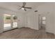 Bedroom with ceiling fan, tile floors, backyard access, and closet at 723 E Piute Ave, Phoenix, AZ 85024