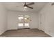 A bright bedroom with a ceiling fan and sliding glass doors leading to a private backyard area at 723 E Piute Ave, Phoenix, AZ 85024
