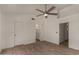 Large bedroom with ceiling fan, tiled flooring, and a bathroom at 723 E Piute Ave, Phoenix, AZ 85024
