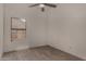 Bedroom with modern ceiling fan and wood-look tile flooring at 723 E Piute Ave, Phoenix, AZ 85024